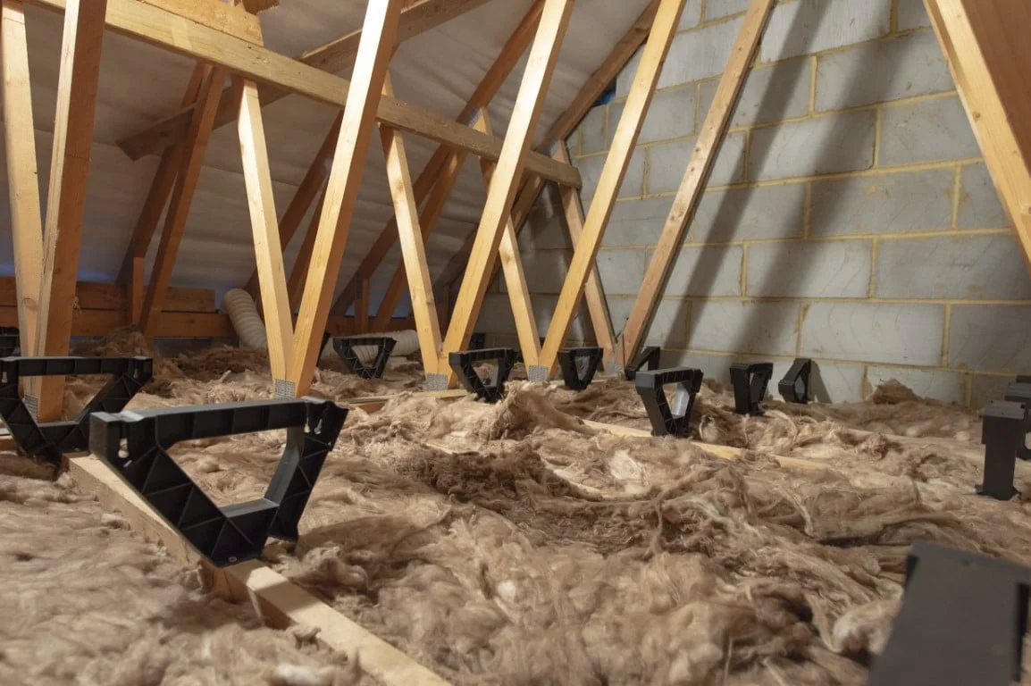LoftZone StoreFloor Tri-Supports standing over wool insulation in a Dublin attic